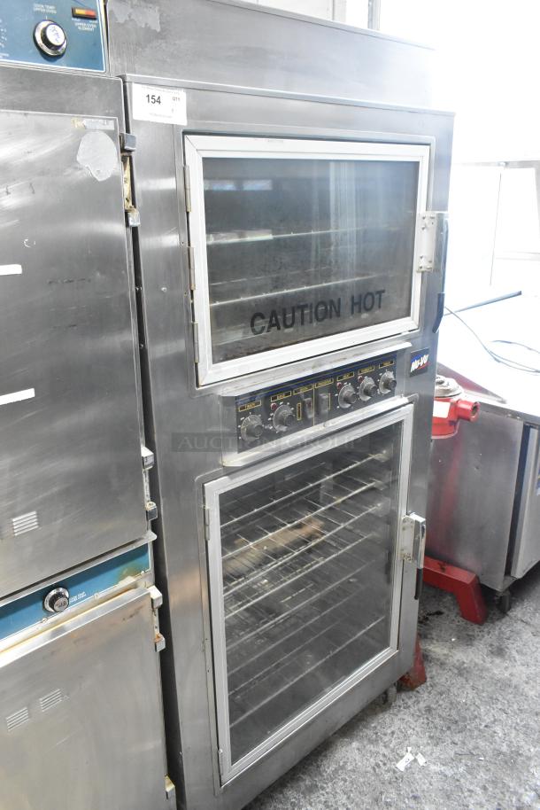 Nu Vu SUB-123 stainless steel commercial oven proofer on casters, 208 volts, 3 phase. Features glass door with "Caution Hot" label.