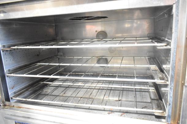 Nu Vu SUB-123 stainless steel oven proofer with racks, visible interior, on commercial casters, 208 volts, 3 phase.