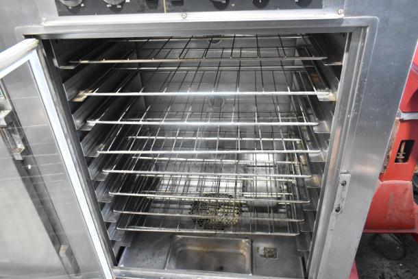 Nu Vu SUB-123 stainless steel commercial oven proofer with racks shown, on casters, 208V, 3-phase, good condition.