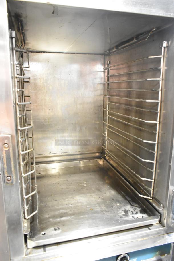 Alto Shaam 1000-TH-I stainless steel commercial cook-n-hold oven, interior view, on commercial casters; used condition.