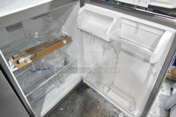 Brand new Whirlpool WRT311FZDM05 stainless steel commercial cooler with freezer, interior view, 115V, 1 phase.