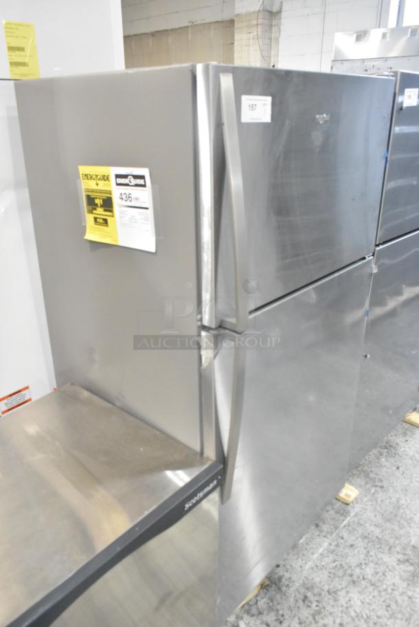 Stainless steel Whirlpool WRT311FZDM05 cooler with freezer, brand new with scratches and dents. Energy Guide label visible.