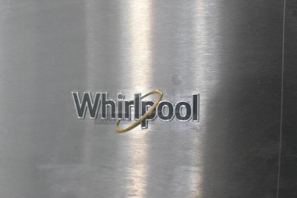 Whirlpool logo on a stainless steel surface, part of the 2025 WRT311FZDM05 commercial cooler with freezer.