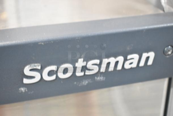 Scotsman Prodigy C1030MA-32B stainless steel commercial ice head, 208/230 volts, 1 phase, logo visible, minor wear.