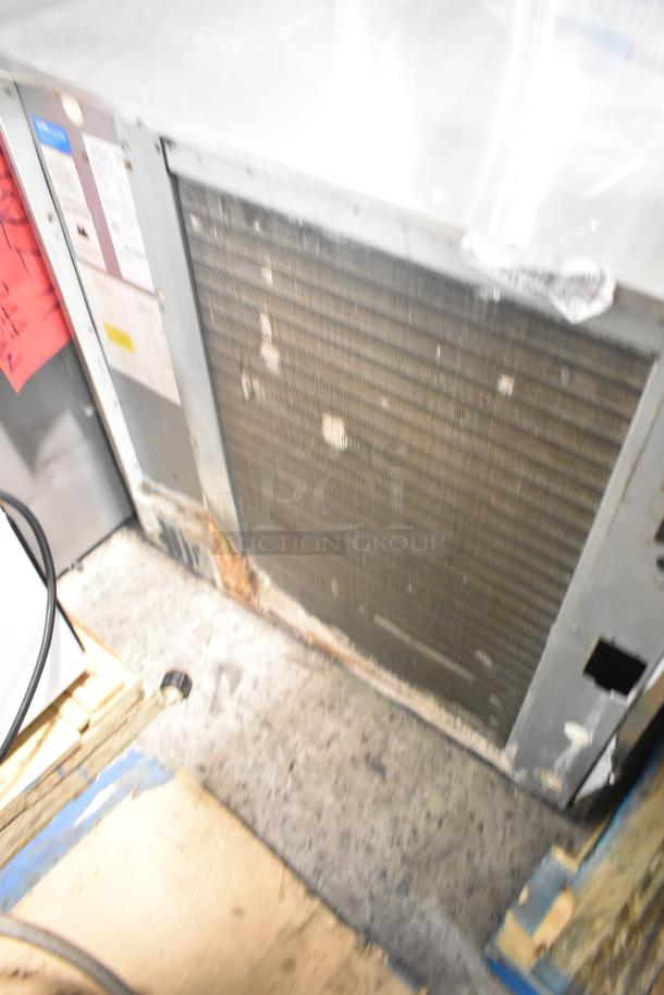 Scotsman Prodigy C1030MA-32B stainless steel commercial ice head, visible label, 208/230 volts, 1 phase, used condition.