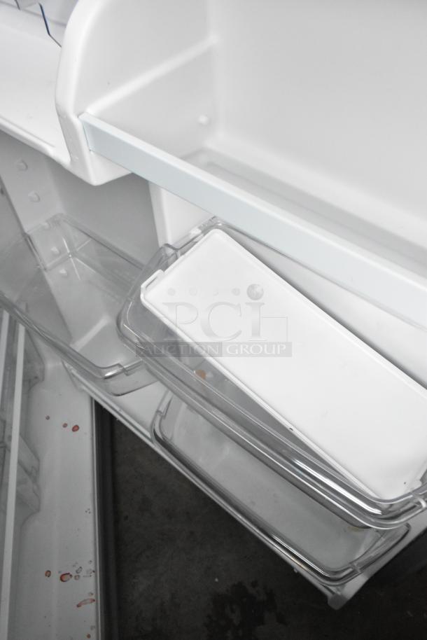 2025 Whirlpool WRT311FZDM05 stainless steel cooler interior view, brand new with minor scratches, freezer included.