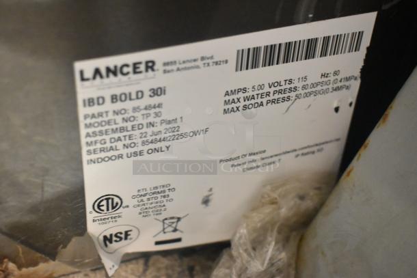 Lancer TP 30 Commercial Beverage Machine label. Features 115 volts, 1 phase. Screen damage noted on auction listing.
