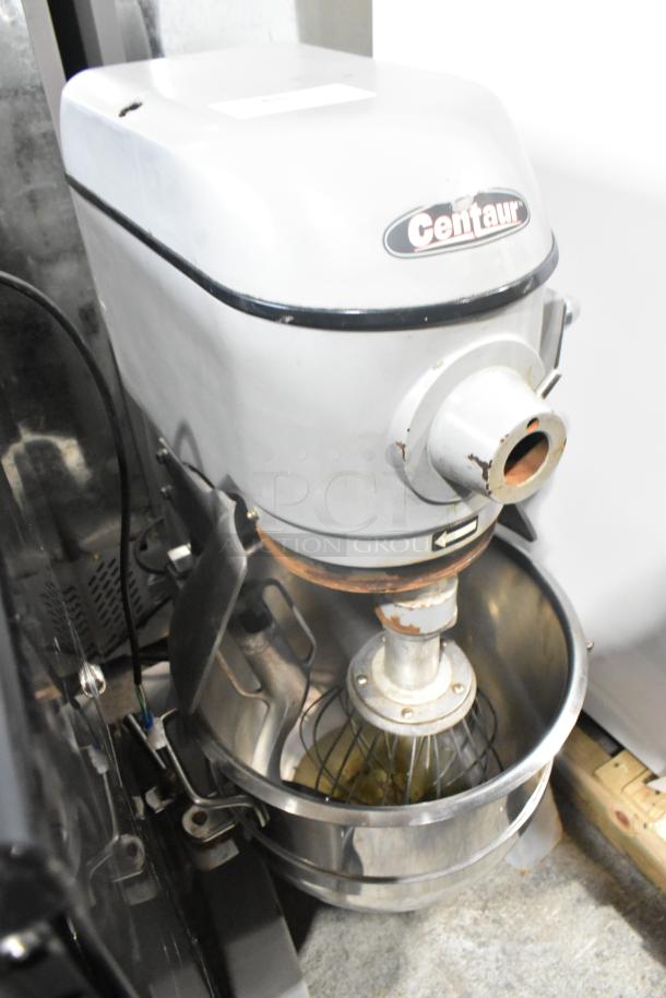 Centaur metal commercial planetary mixer with metal mixing bowl and whisk attachment, 208V, 1 phase, visible wear.