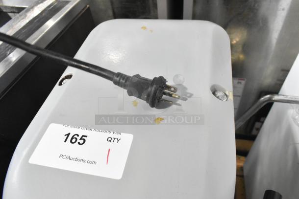 Centaur Metal Commercial Floor Mixer with metal mixing bowl and whisk attachment. Power: 208V, 1 Phase. Auction tag: 165.