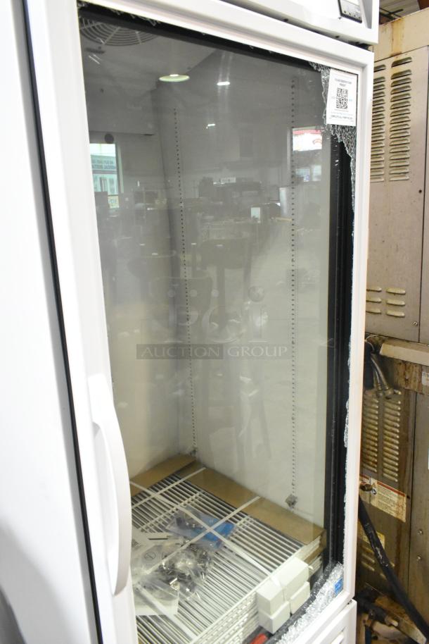 New 2025 True TSCI-600R-G-PH commercial cooler with poly-coated racks. Notable broken glass visible; 115 volts, 1 phase.