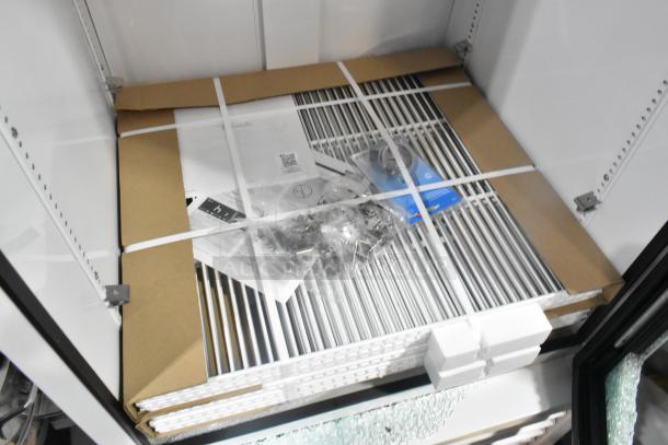 Brand new True TSCI-600R-G-PH cooler merchandiser, scratch and dent, with broken glass, poly coated racks, 115V, 1 phase.