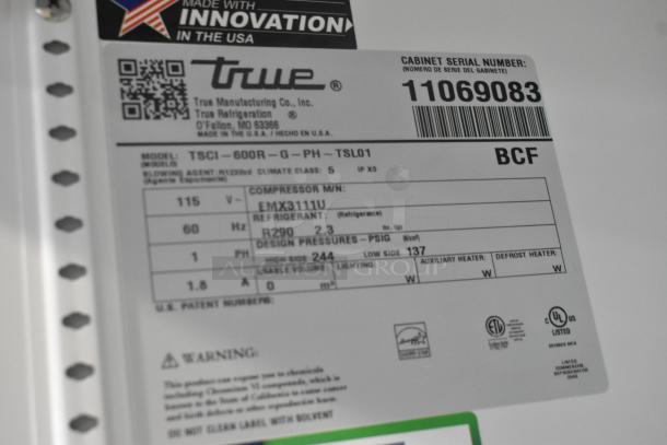 Label on True TSCI-600R-G-PH cooler indicating 115V, 1 Phase, R290 refrigerant; serial number 11069083.