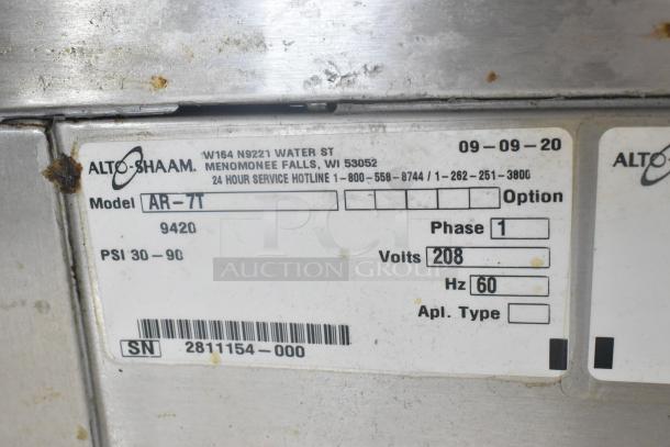 Alto Shaam AR-7T stainless steel rotisserie oven label, showing model AR-7T, 208 volts, 1 phase, PSI 30-90.