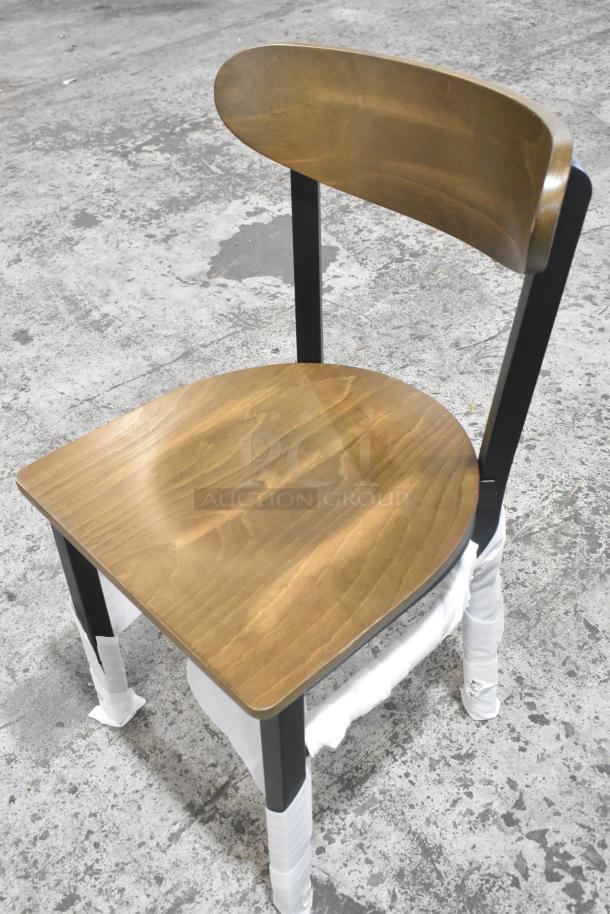 Brand new black metal dining chair with wooden backrest and seat, slight scratches. Auction includes 84 chairs.