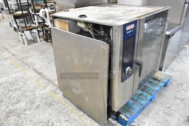 Rational LM100CE.AXXXX iCombi Pro convection oven, stainless steel, commercial grade, partially open, showing interior wiring.