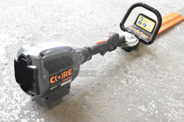 Core CHT410 Gasless Power Bush Trimmer, black and orange, ergonomic handle, durable condition, visible control panel.