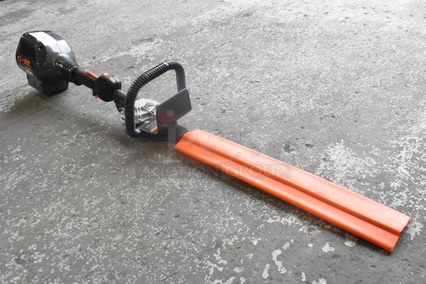 Core CHT410 Gasless Power Bush Trimmer, orange and black, in good condition, featuring ergonomic handle design.