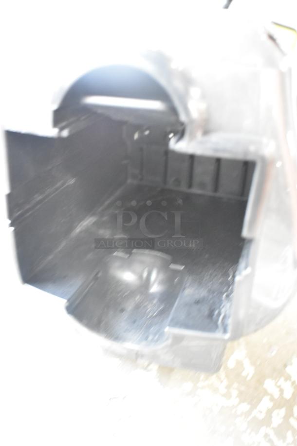 Core CHT410 Gasless Power Bush Trimmer, showing internal compartment. Appears in used condition. Model label visible.