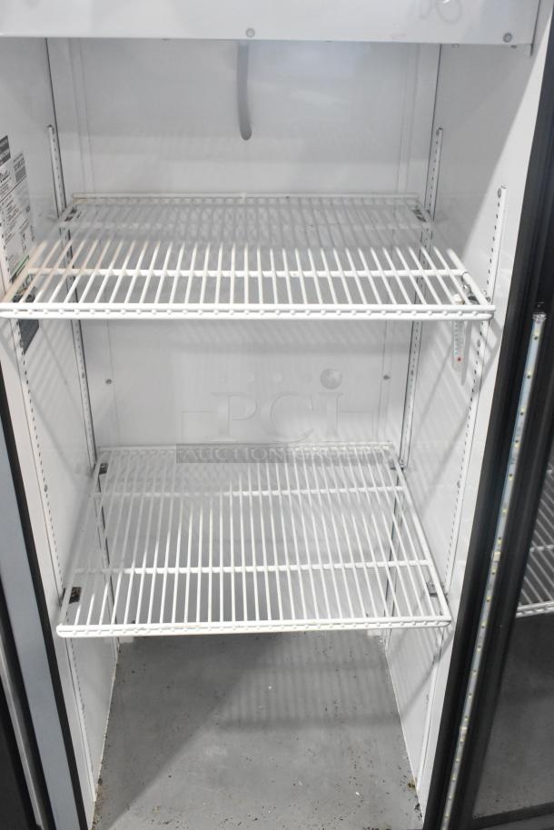 2021 True GDM-12-HC commercial cooler, metal frame, single door, poly coated racks, 115V, 1 phase, excellent condition.