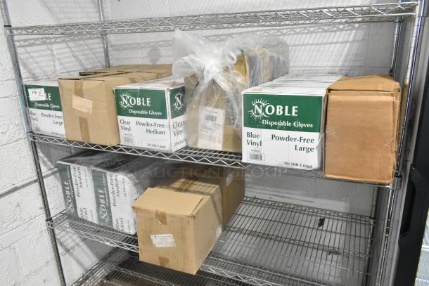 Two-tier shelf with Noble Products disposable vinyl gloves, including 394405L and 394365M models, in original packaging.