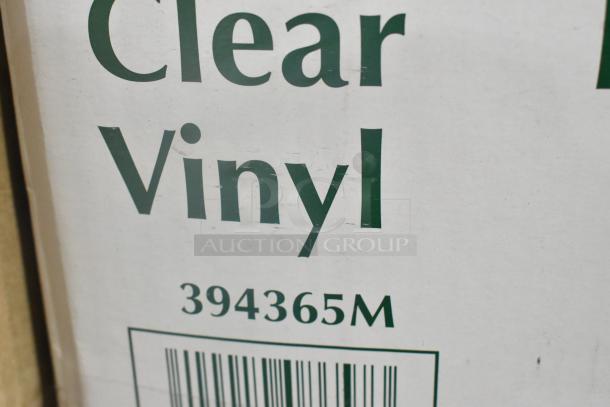 Close-up of a Noble Products packaging label displaying "Clear Vinyl" and product number 394365M for disposable gloves.