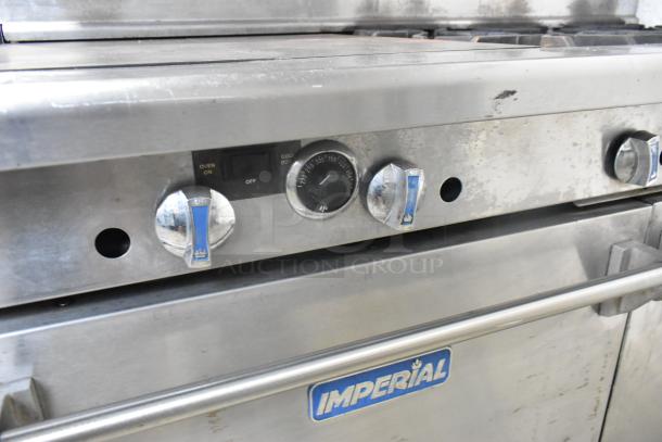 Imperial stainless steel commercial gas flat top griddle with 6 burners, convection oven, standard oven, shelf, and backsplash.