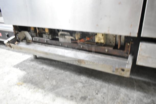 Imperial stainless steel commercial gas griddle, 6 burner range, convection and standard oven; wear visible.
