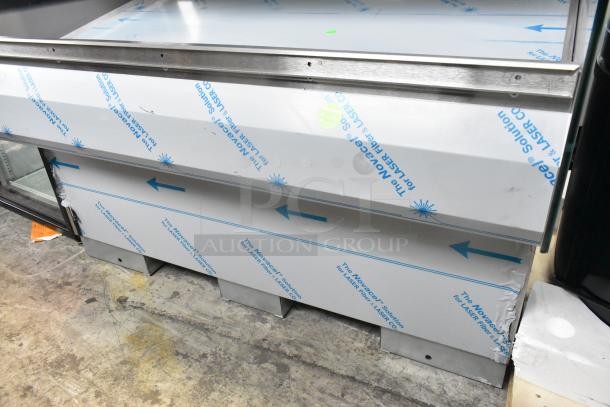 BRAND NEW 2016 BKI HSS4-2TSQ stainless steel 2-tier warming display case, 230V, with protective film, slight dents visible.