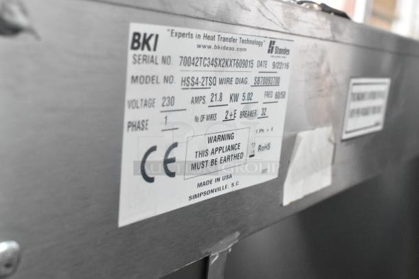 Label on 2016 BKI HSS4-2TSQ stainless steel warming display case showing model, voltage 230, and phase 1 specs.