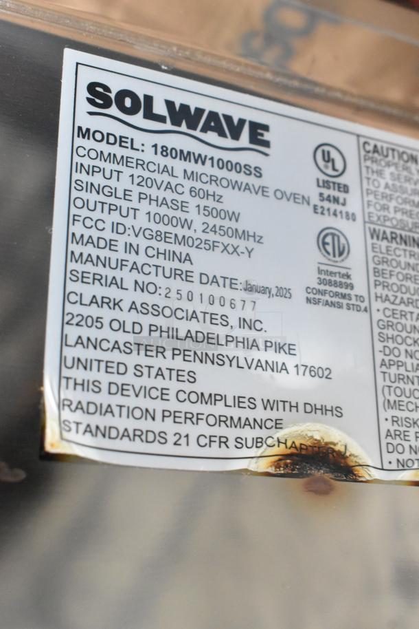 Solwave 180MW1000SS microwave label showing specs, including 120V, 1 Phase, 1500W input, made in China. Minor scratches visible.
