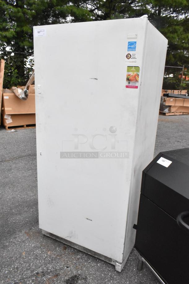 Frigidaire FFUH21F2NWA metal single door reach-in freezer, 115 volts, 1 phase, with visible energy labels.