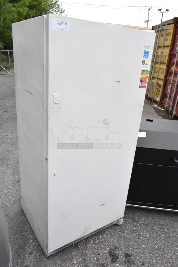 Frigidaire FFUH21F2NWA metal single door reach-in freezer, 115 volts, 1 phase, visible wear, with energy efficiency labels.