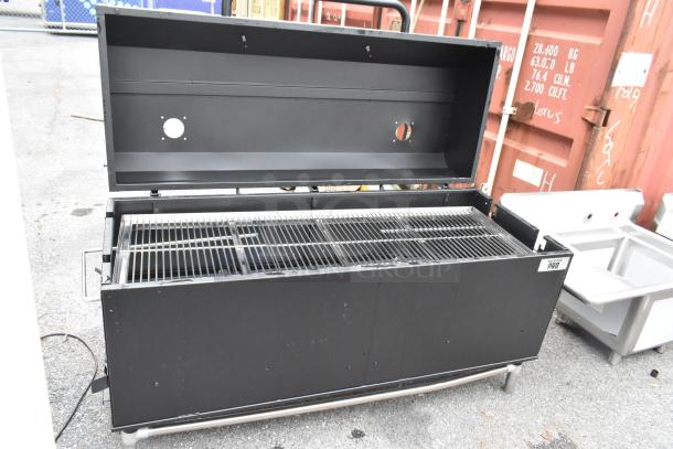 Backyard Pro metal commercial grill with lid open, featuring commercial casters, in good condition.