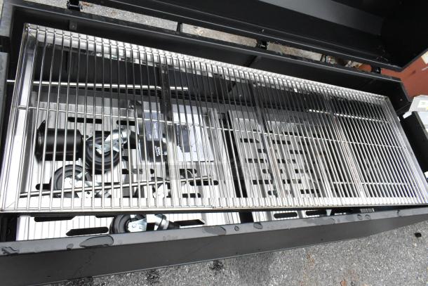 Backyard Pro Metal Commercial Grill with chrome grates and commercial casters, shown in excellent condition.