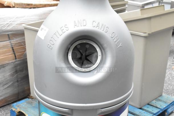 Gray bottle-shaped recycling bin with "Bottles and Cans Only" embossed. Used condition, ideal for eco-friendly spaces.