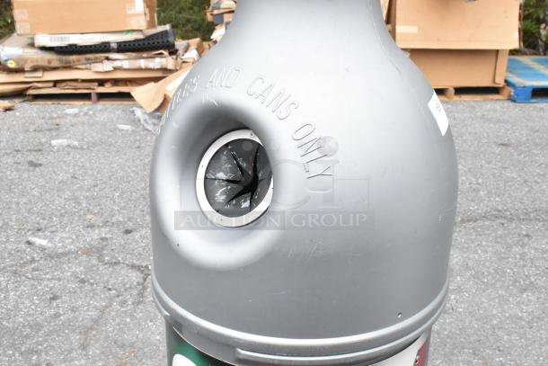 Gray bottle-shaped recycling bin for bottles and cans, labeled "BOTTLES AND CANS ONLY," in good condition.