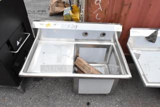 BRAND NEW scratch and dent Regency 600S1181818L stainless steel single bay sink with left side drain board, visible markings.