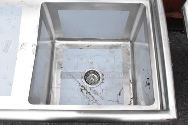 Brand new Regency 600S1181818L stainless steel single bay sink with left side drain board, scratches visible.