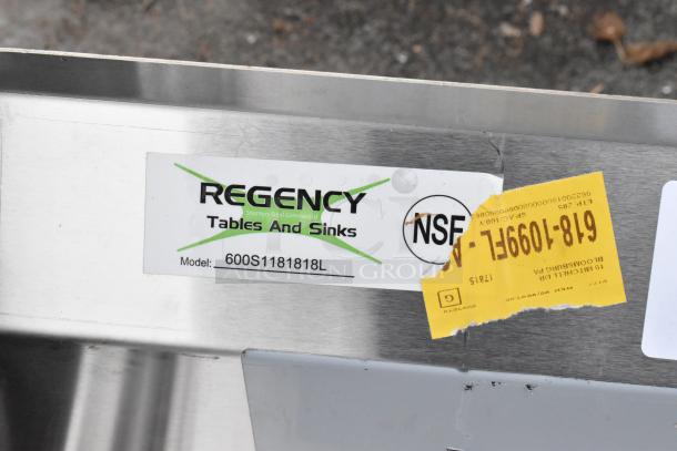 Regency stainless steel single bay sink, model 600S1181818L, with left drain board. Scratch and dent condition, NSF label visible.