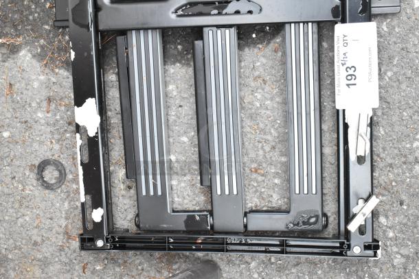 Black metal unit with slight paint chipping, featuring adjustable slots. Auction tag reads "193" by PCAuctions. Fair condition.