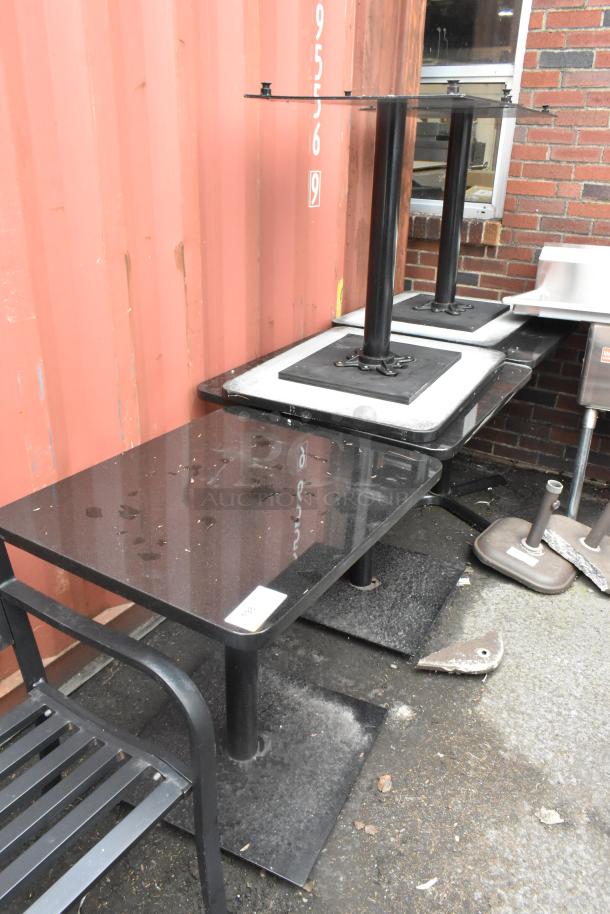 Set of 5 black stone pattern dining-height tables on black metal bases. Moderate condition, suitable for restaurant use.