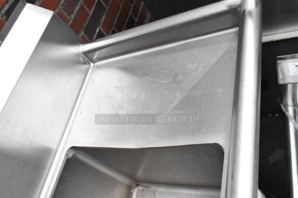 Regency stainless steel 3 bay sink with dual drain boards, faucet, and handles, in used condition. Model 600S31416212.