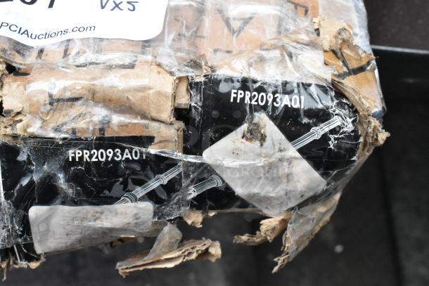 Five assorted table base parts wrapped in packaging, featuring labels with model number FPR2093A01 and auction tag.