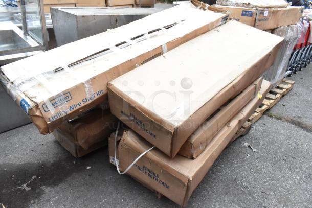 Boxes labeled "Steelton Utility Wire Shelf Kit" on a pallet. Includes Bobrick B-3942 dispensers and 465C1872KE5 shelf unit.