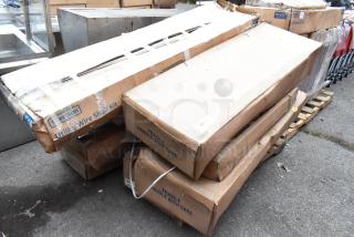 Boxes labeled "Steelton Utility Wire Shelf Kit" on a pallet. Includes Bobrick B-3942 dispensers and 465C1872KE5 shelf unit.