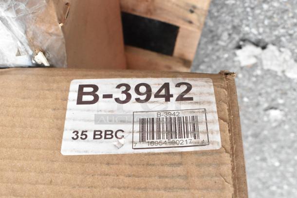 Box with label for Bobrick B-3942 ClassicSeries paper towel dispenser. New condition, slight scratch and dent noted.