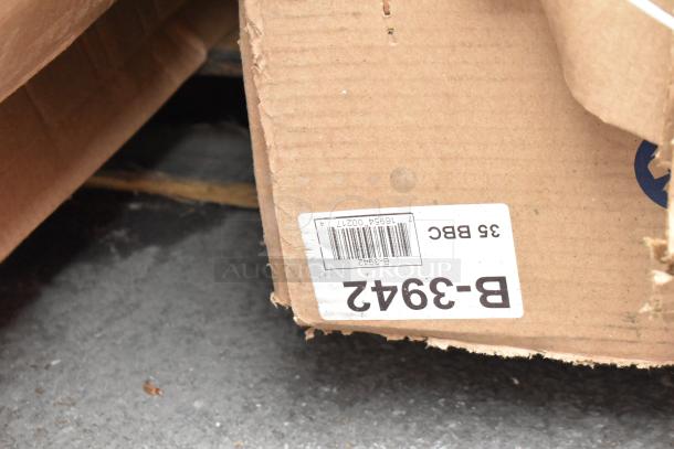 Cardboard box with a partial label visible, indicating "B-3942" and "35 BBC." Box appears slightly damaged.