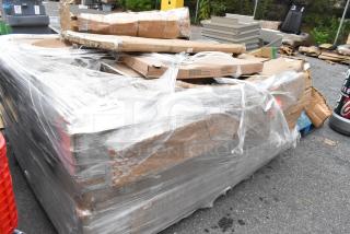 Sealed pallet of 16 new scratch and dent Lancaster tables, includes round and rectangular models, in original packaging.