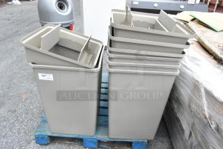 Tan poly trash cans, brand new with scratches and dents. Includes four lids. Five cans shown, stacked on a pallet.