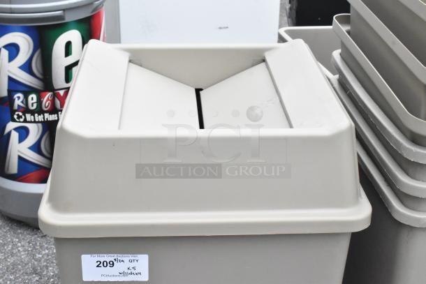 Tan poly trash cans with 4 lids, scratch and dent condition, quantity label shows "209" at PCI Auctions.